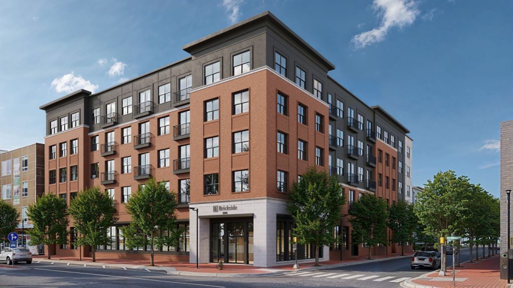 Front view of Brickside student apartments on Hillsborough Street next to NC State, featuring modern brick exterior